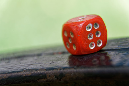 Close-up dice with defocused background, chance for winning.
