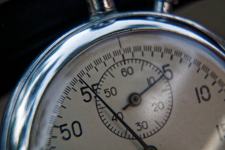 Stopwatch lies on bench close-up, time shift concept.の写真素材