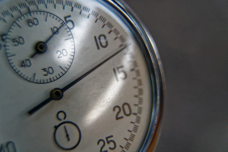 Stopwatch lies on bench close-up, time shift concept.の写真素材