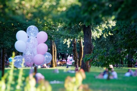 Kyiv - Ukraine, 11.08.2018: Pink balloon in the autumn field. Funny mood, prepare for celebrating, holiday event or partyのeditorial素材