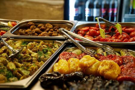 Street food on night outdoor market. Spicy, seafood, veggie, vegetable hot mealの写真素材