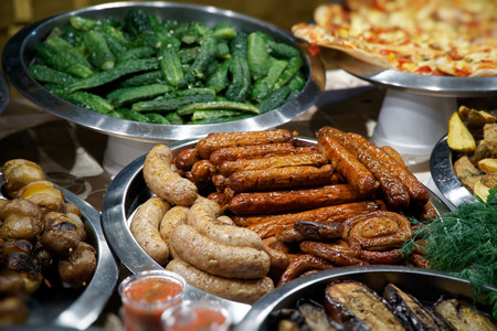 Street food on night outdoor market. Spicy, seafood, veggie, vegetable hot mealの写真素材