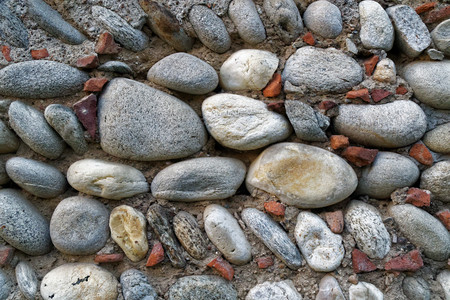 Pebbles ancient wall background,closeup big stones