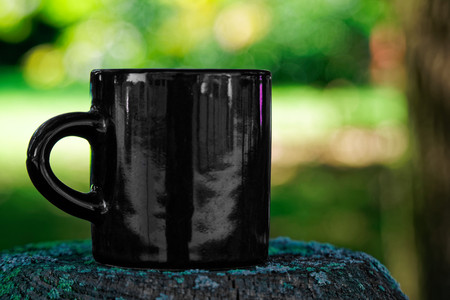 Vintage grunge Cup of tea or coffee on defocused background.