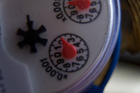 Water meter close-up. Measurement of water flow