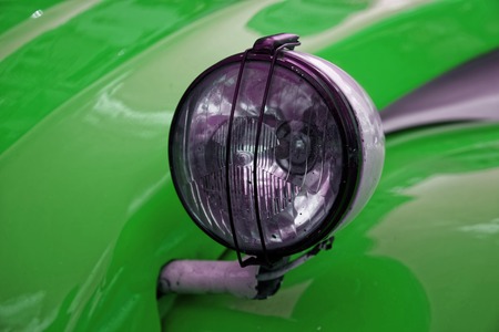 Headlamp of green vintage car, business conceptの写真素材