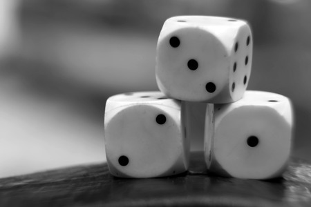 Monochrome  dice with defocused background, chance for winning.の写真素材