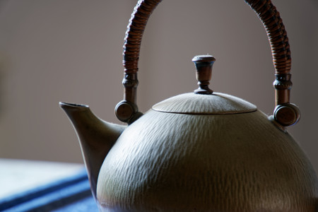 Old antique brass teapot on table, close-up image.の写真素材