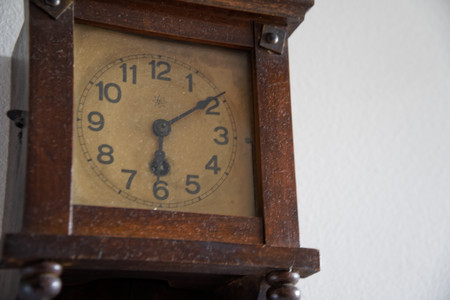 Vintage clock whith time on the wall.の写真素材