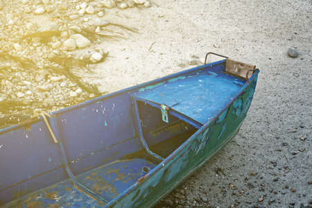 River drought, blue boat without water due global warming.の写真素材