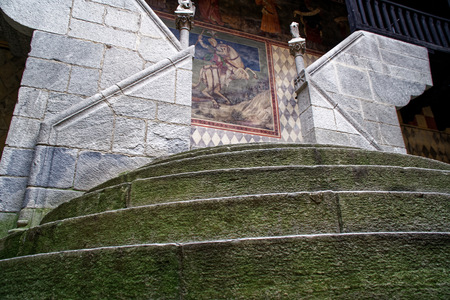 Stone round steps on narrow medieval streetの写真素材