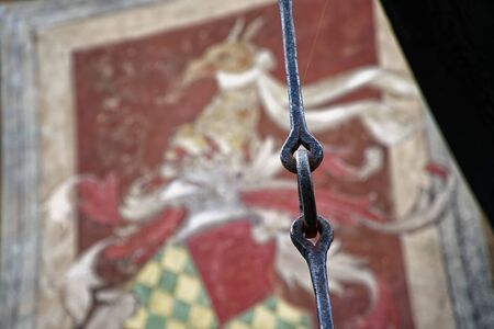 Blocker Tie Ring for horse, Ornate iron horse tie ring on the facade of medieval castle, Torino, Italyの写真素材