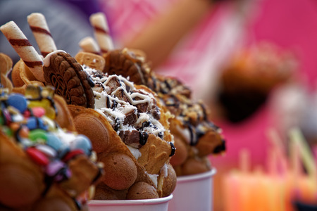 Fresh sweet bakery with candies and ice cream street food.