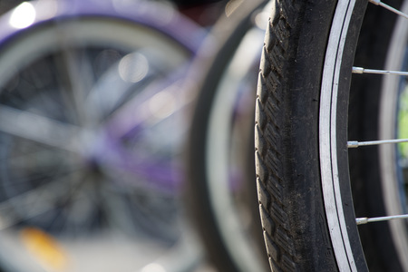 Bicycle wheel in a row close-up wheel detail, bicycle spokeの写真素材
