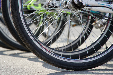 Bicycle wheel in a row close-up wheel detail, bicycle spokeの写真素材