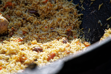 Fried rice with chicken, prepared and served in wok. Natural healthy food.の写真素材