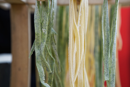 Homemade pasta - Closeup of process of making cooking. Chef make fresh italian traditional pasta.の写真素材