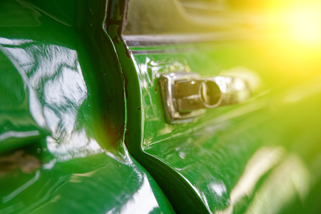 Edge door of car Door handle of retro classic car, Vintage tone.の写真素材