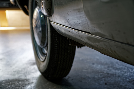 Vintage wheel of classic car, shiny car body, selective focus.の写真素材