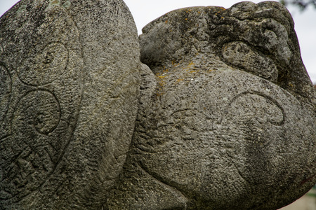 Carved stone - ancient inscription and nature lines ornate.の写真素材