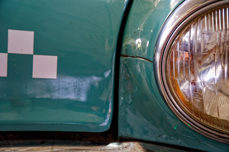 Headlight of antique old car, detail on the headlight of a vintage car. Selective focus.の写真素材