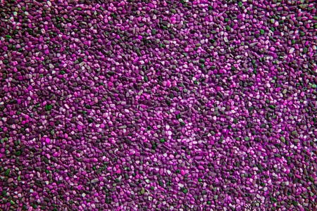 Fuchsia rose pebbles create nice pattern, gravel texture.の写真素材