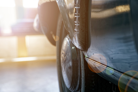 Vintage wheel of classic car, shiny car body, selective focus.の写真素材