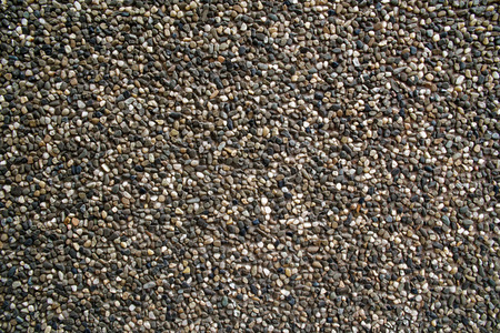 Small brown pebbles create nice pattern, gravel texture.の写真素材