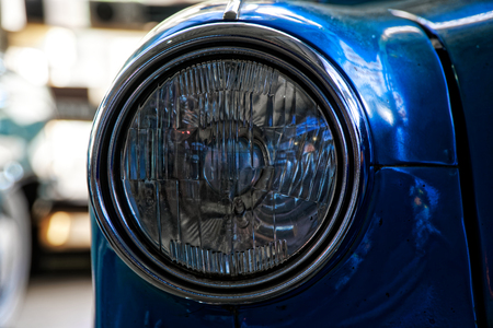 Headlight of antique old car, detail on the headlight of a vintage car. Selective focus.の写真素材