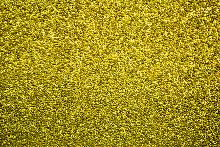 Dandelion colored pebbles create nice pattern, gravel texture.の写真素材