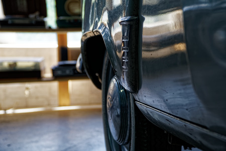 Vintage wheel of classic car, shiny car body, selective focus.の写真素材
