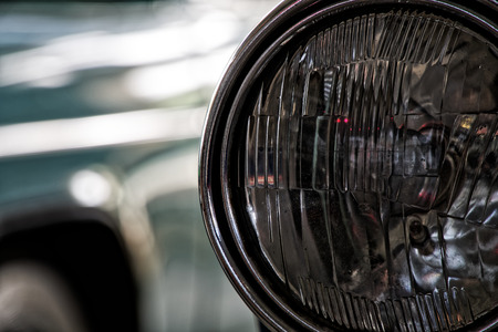 Headlight of antique old car, detail on the headlight of a vintage car. Selective focus.の写真素材