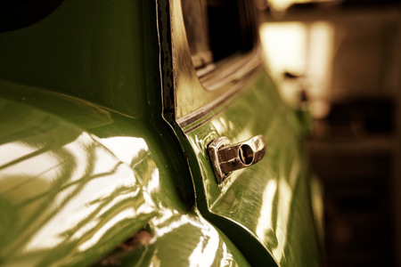 Edge door of car Door handle of retro classic car, Vintage tone.の写真素材