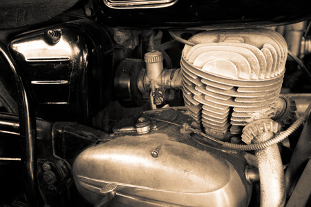 Old motorcycle motor engine in vintage photo.の写真素材