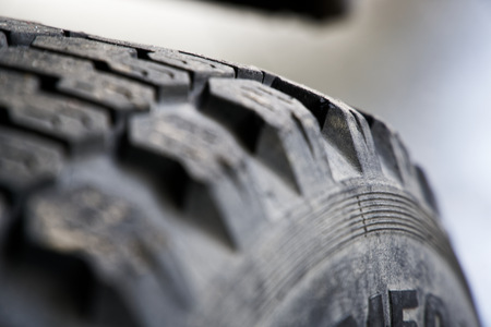Car tires from old track, selective focus, close-up rough surface.の写真素材