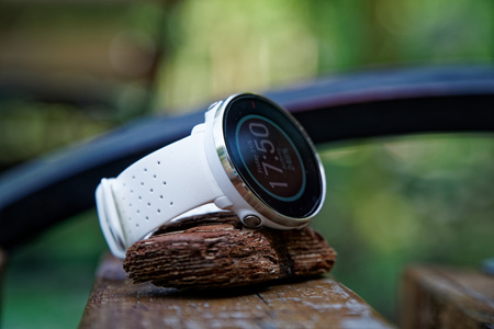 Close-up sport watch for running white color on wooden bench. Fitness watch for tracking daily activity and power trainingの写真素材