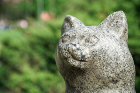Cat statue from stone. Lucky rock cat head.の写真素材