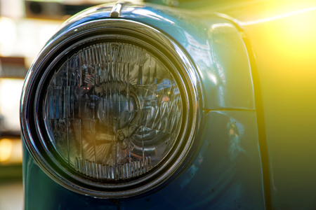 Headlight of antique old car, detail on the headlight of a vintage car. Selective focus.の写真素材