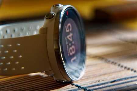 Sport watch in white color on wooden table, Smart watch for running and fitness trainingの写真素材