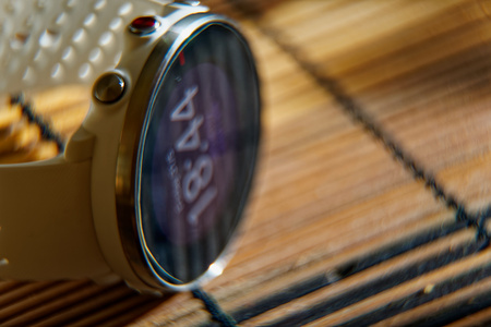 Sport watch in white color on wooden table, Smart watch for running and fitness trainingの写真素材
