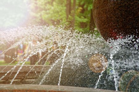 Stream of water from the granit fountainの写真素材