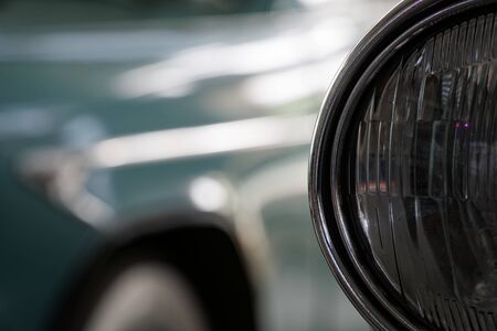 Headlight of antique old car, detail on the headlight of a vintage car. Selective focus.の写真素材