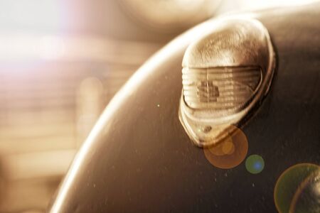 Headlight of antique old car, detail on the headlight of a vintage car. Selective focus.の写真素材