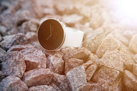 Sport watch for triathlon on the granite gravel. Smart watch for tracking daily activity and strength training. With words - Show my heart rate.の写真素材