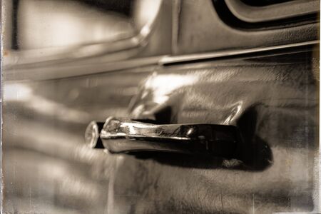 Edge door of car Door handle of retro classic car, Vintage tone.の写真素材