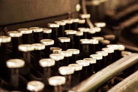 Old typewriter in antique photography vintage simulated, grunge photo.の写真素材