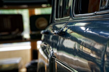 Polished car body with light reflection, sunny bunny on old vintage car, business consept.の写真素材