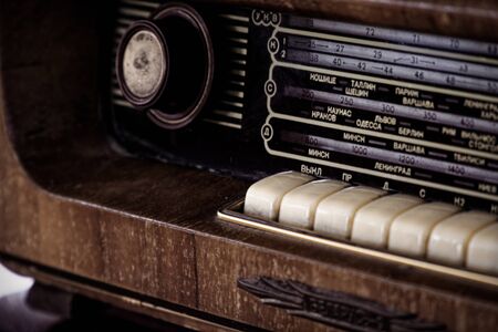 Vintage style radio in wooden box and fabric front.の写真素材