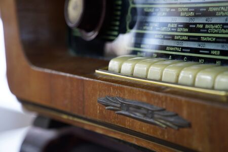 Vintage style radio in wooden box and fabric front.の写真素材