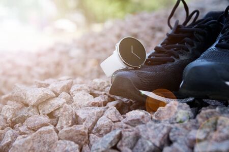 Sport watch for crossfit and triathlon on the running shoes. Smart watch for tracking daily activity and strength trainingの写真素材